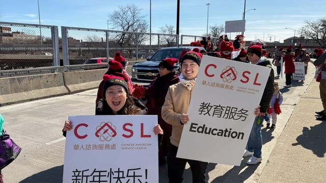 Viana Chau and boyfriend holding CASL signs