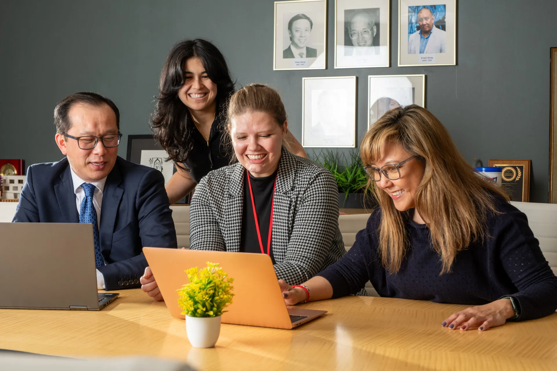 Four people working in an office