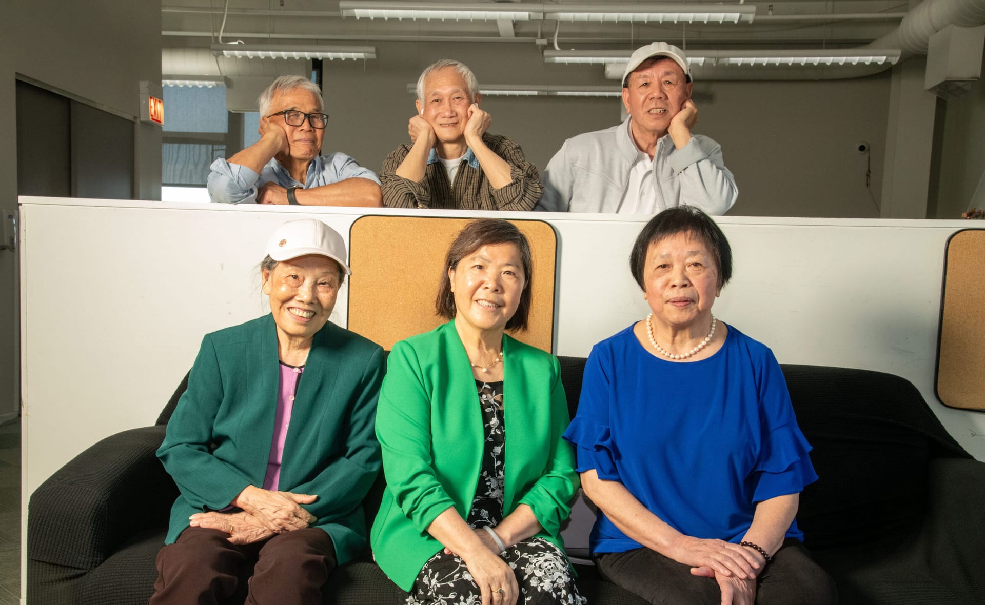 Three men and three women smiling for the camera.