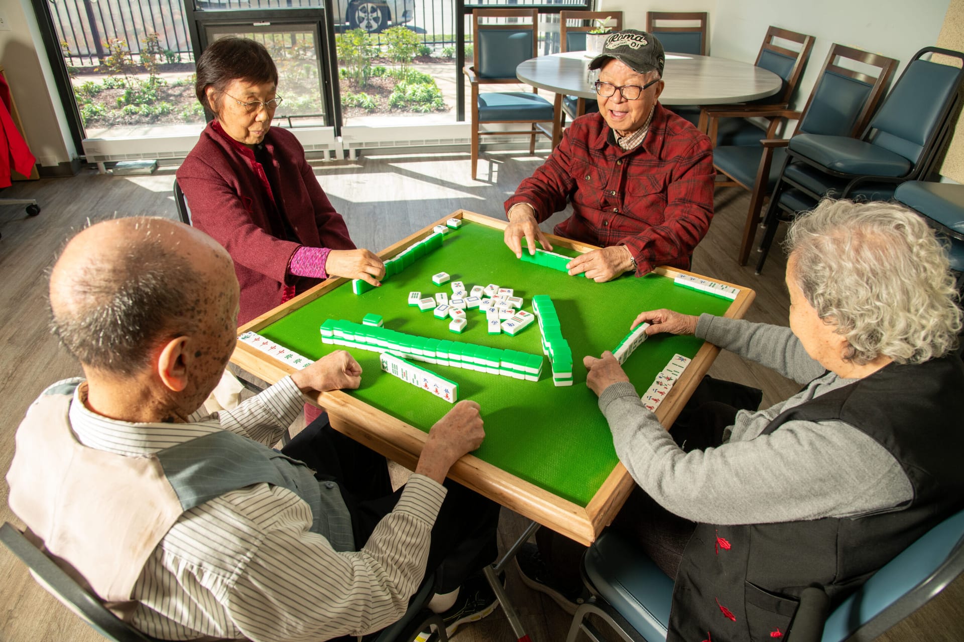 CASL older adults playing Mahjong.