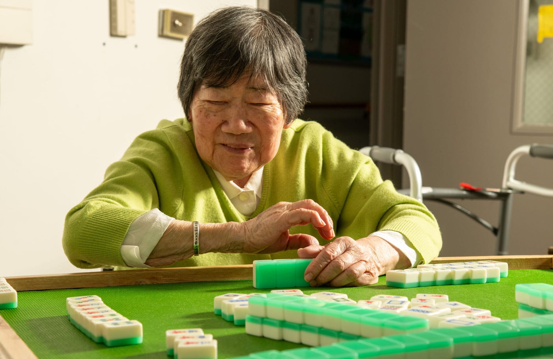 Woman playing Mahjong.