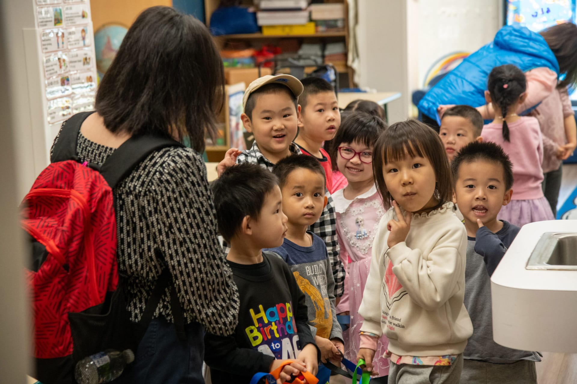CASL school children line up in hallway.