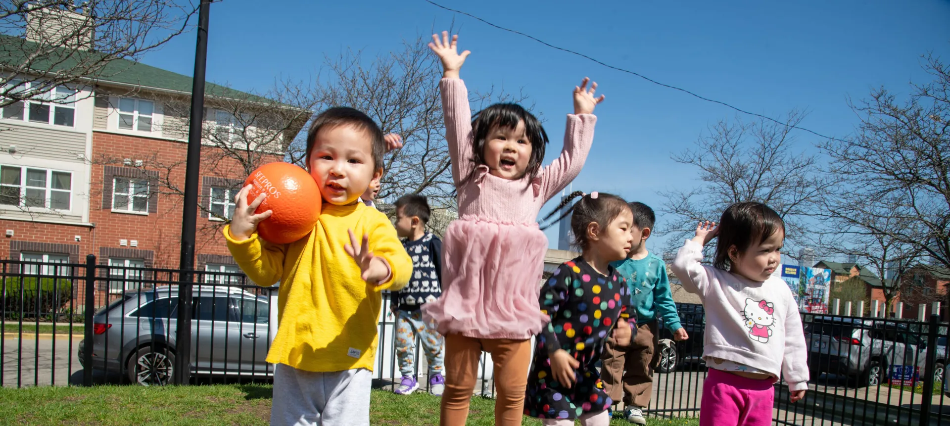 Toddlers playing outdoors.