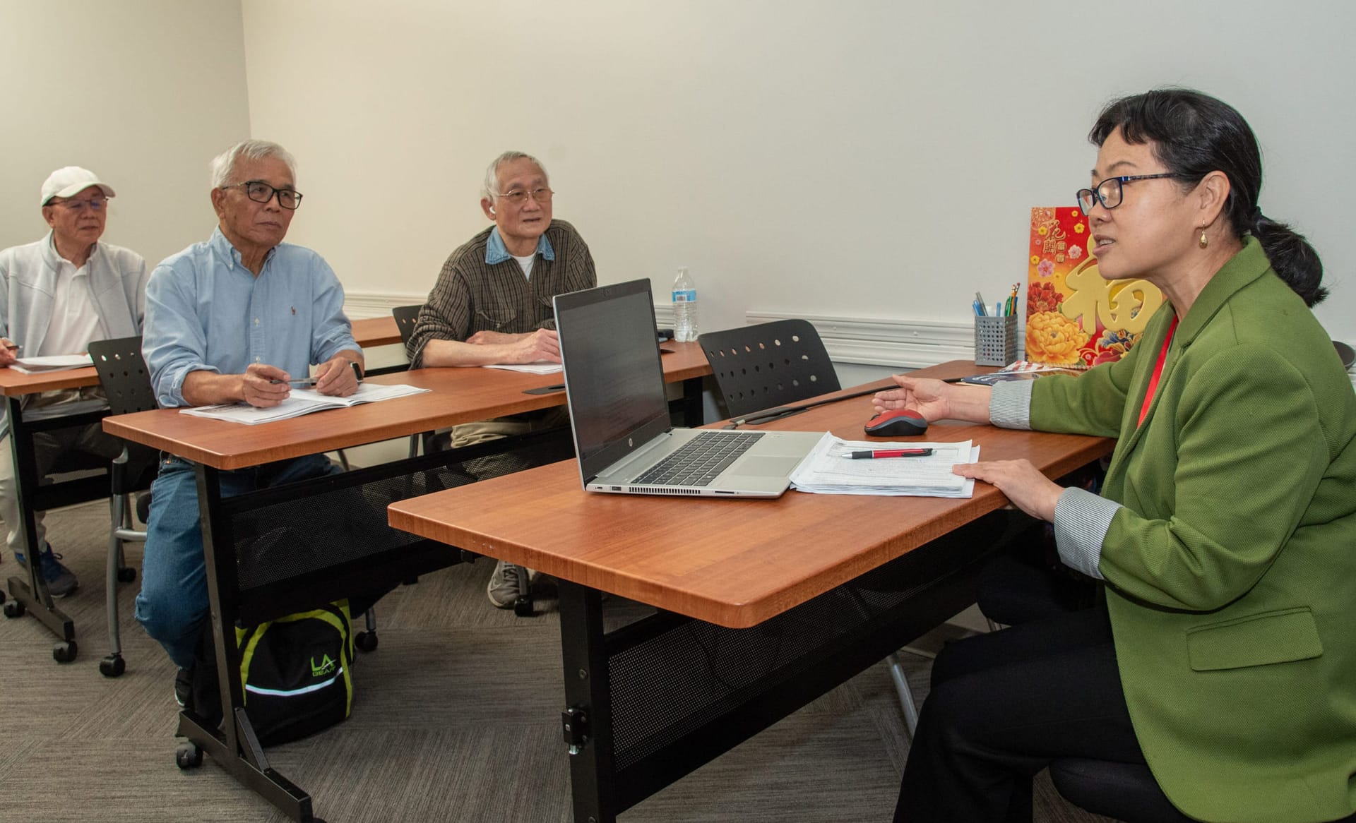 Adults learning new skills in a classroom.