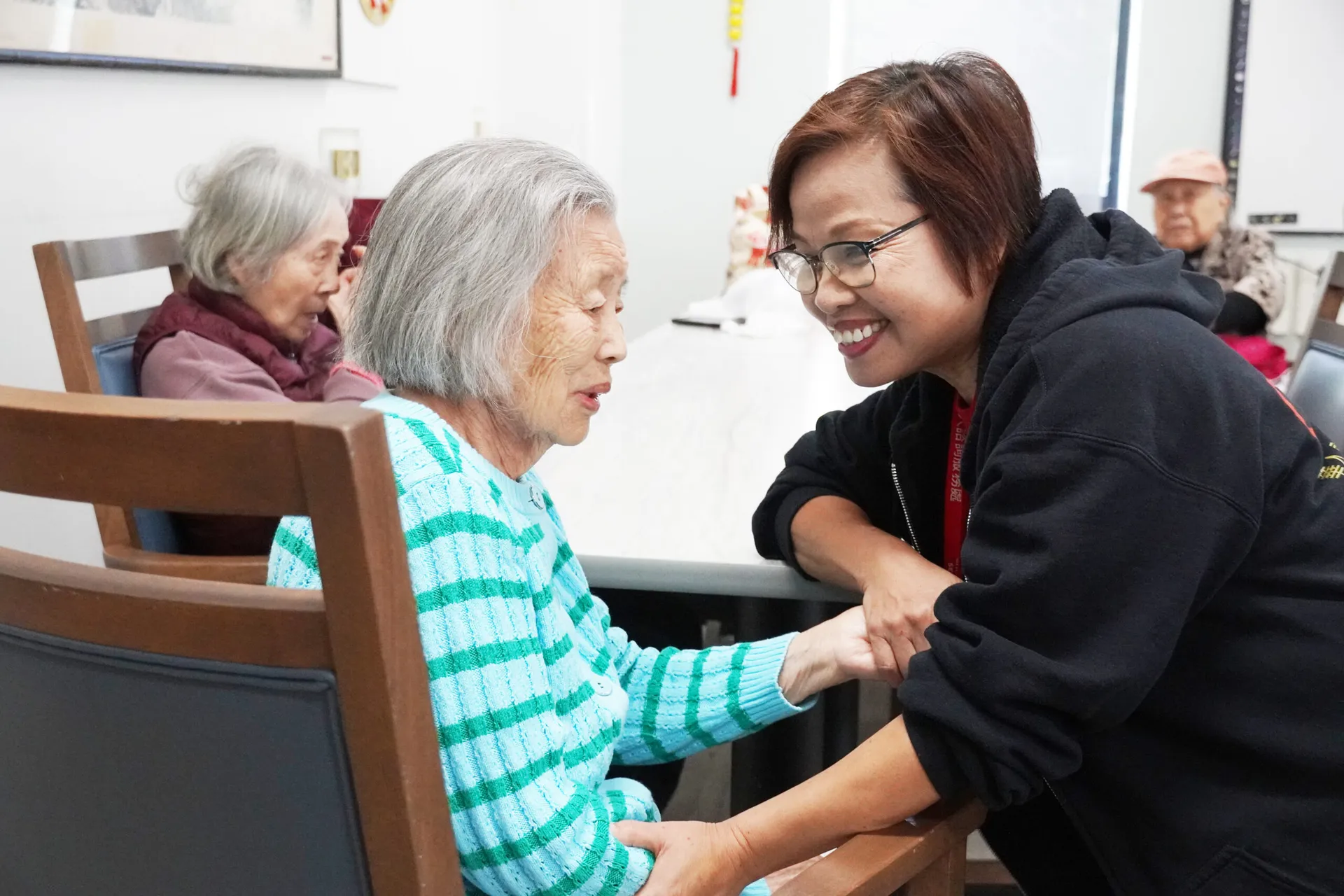 Shuyi taking care of a CASL older adult