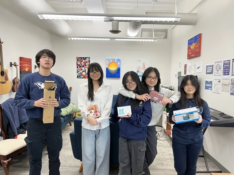 CASL students holding presents